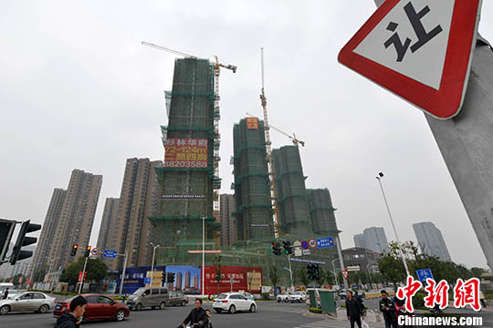 資料圖：一處商品房在建中。 <a target='_blank' href='http://www.chinanews.com/'>中新社</a>記者 呂明 攝