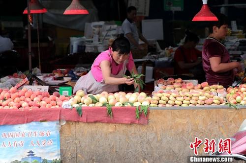 資料圖：菜市場商家。<a target='_blank' href='http://www.chinanews.com/'>中新社</a>記者 張遠(yuǎn) 攝